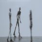 statuettes humanoïdes bronze société Coronavirus : faire face